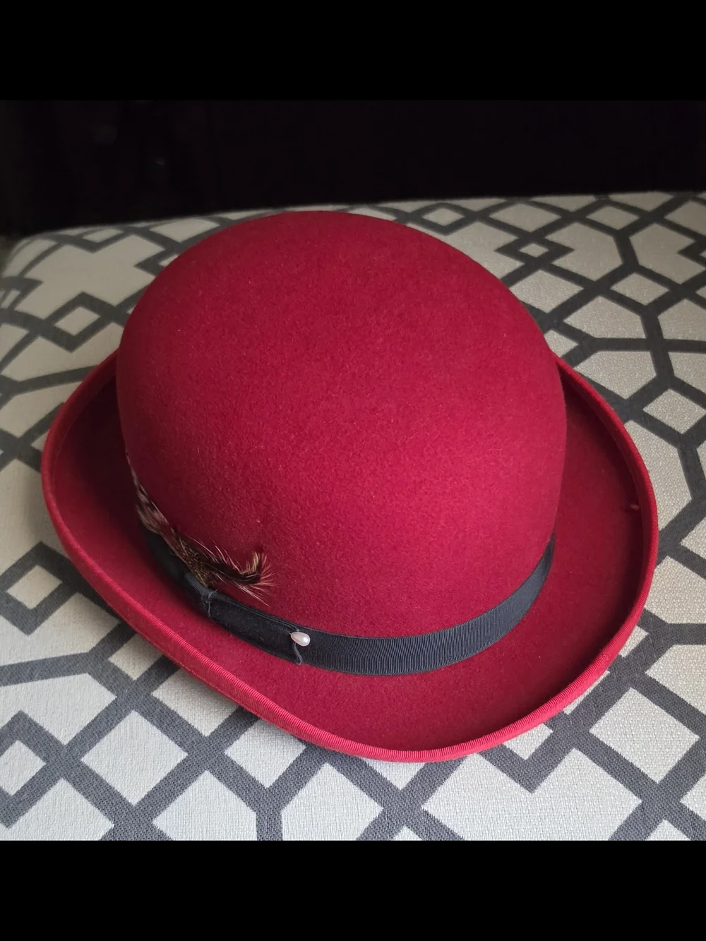 Men's Red Wool Bowler Hat with Black Band and Feather Accent